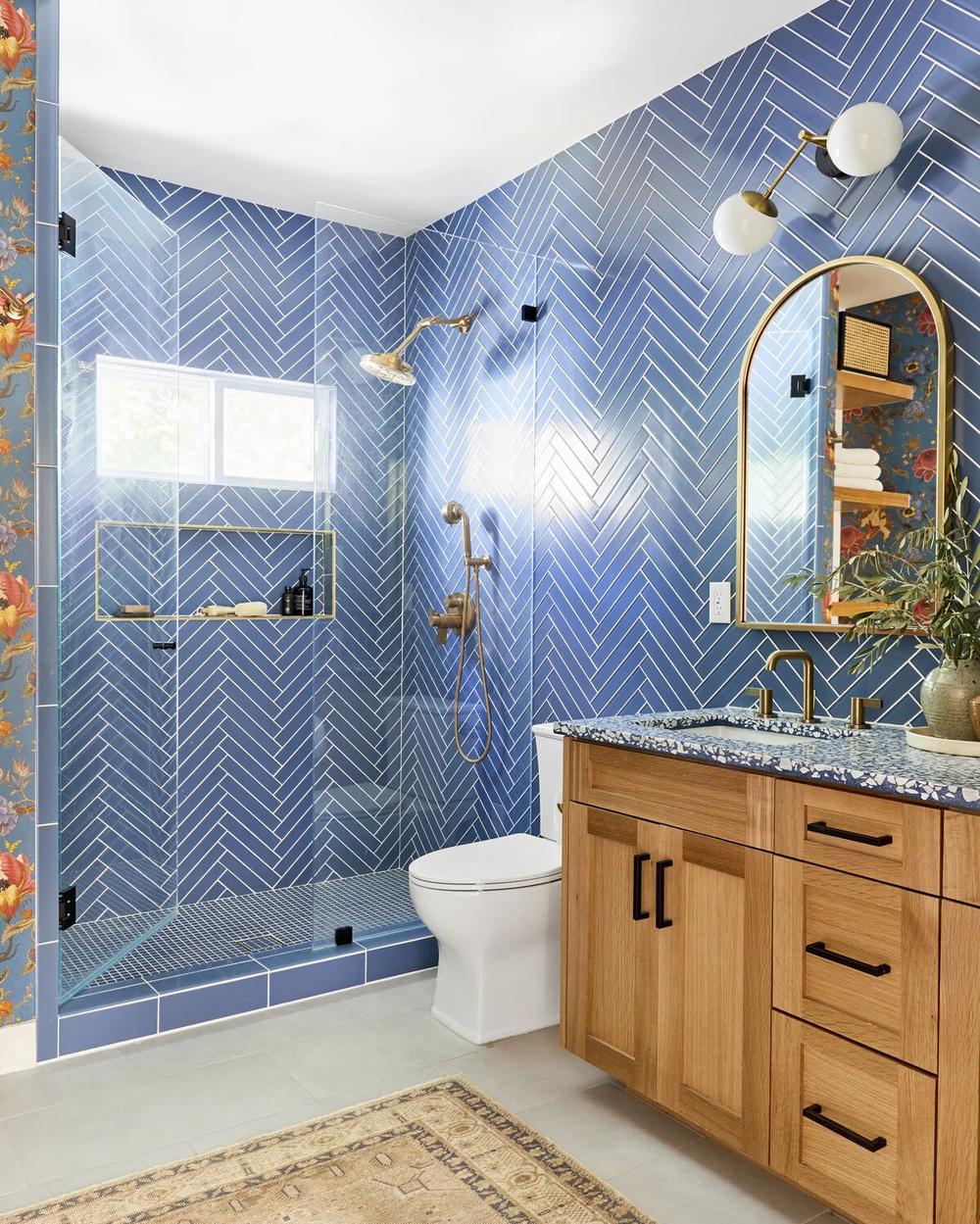 Luxury blue herringbone tile bathroom remodel by Grand Prestige Remodels Pike Road Alabama