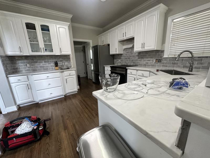 Kitchen remodel white cabinets marble countertops Montgomery AL